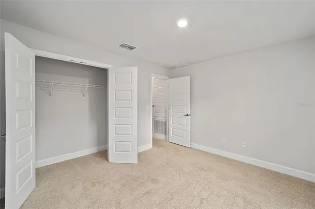 a view of a big room with a big yard and potted plants
