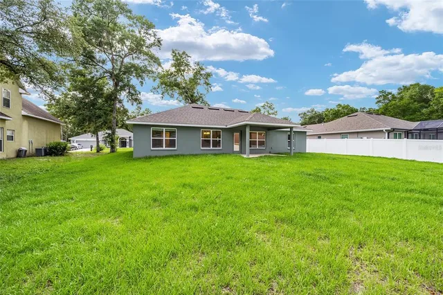 a view of a lake with a yard