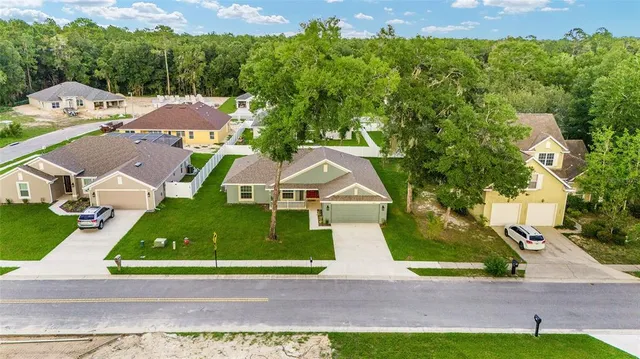 an aerial view of house swimming pool and outdoor space