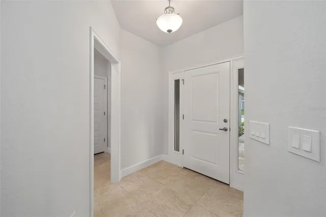 a view of a kitchen with a refrigerator and a sink