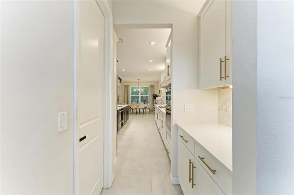 a view of walk in closet with clothes