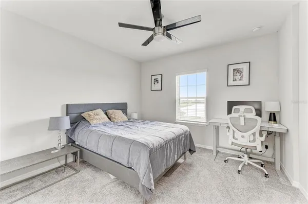 a living room with furniture and white walls