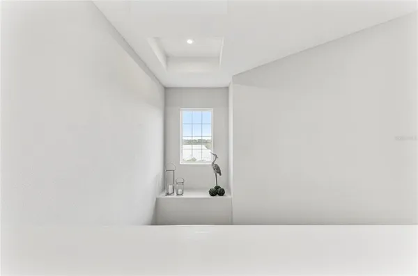 a bedroom with a bed couch and window