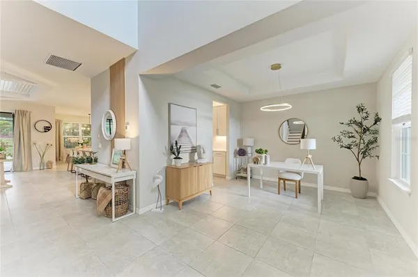 a large kitchen with kitchen island a counter top space a sink stainless steel appliances and cabinets