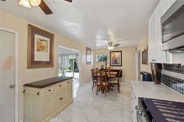 a dining room with furniture and window