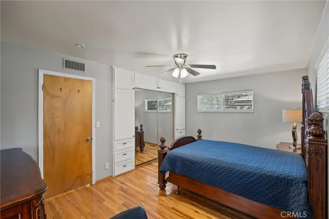 a bedroom with a bed and a table in it