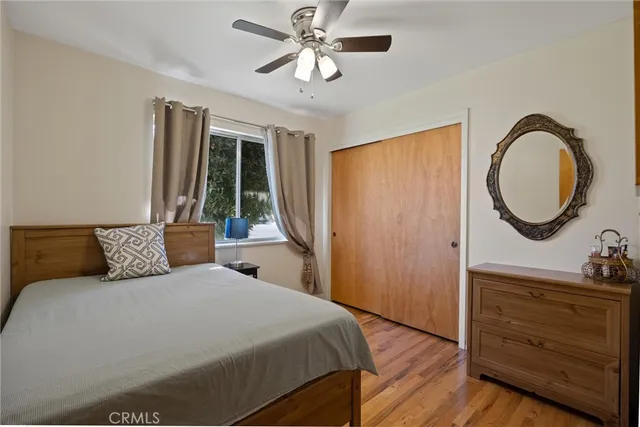 a bedroom with a bed and a dresser