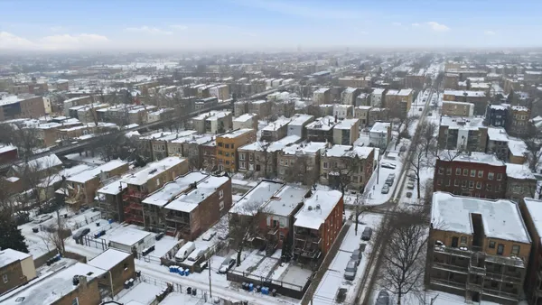 an aerial view of a city with lots of residential buildings
