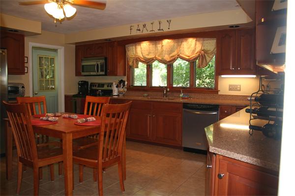 53 Fox Farms Road Northampton, MA 01062 - Photo 5 of 5 a kitchen with a stove a sink and a refrigerator