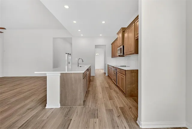 a view of a kitchen from the hallway