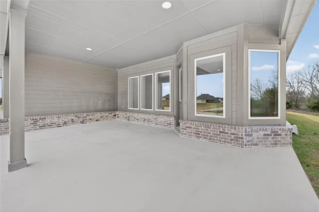 a front view of house with yard and outdoor seating