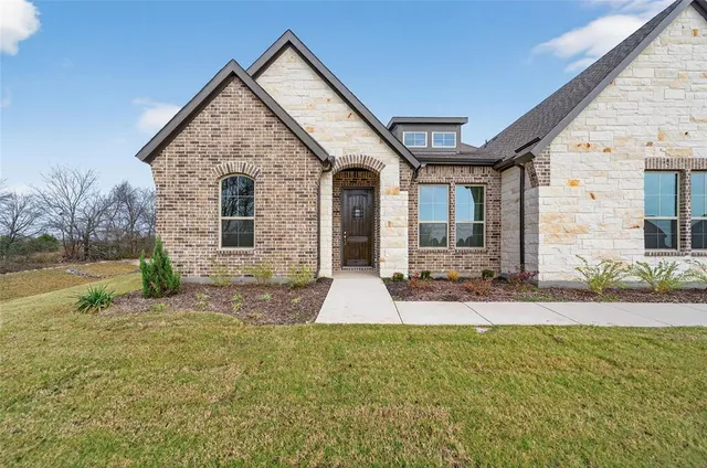 a view of backyard of house with entertaining space