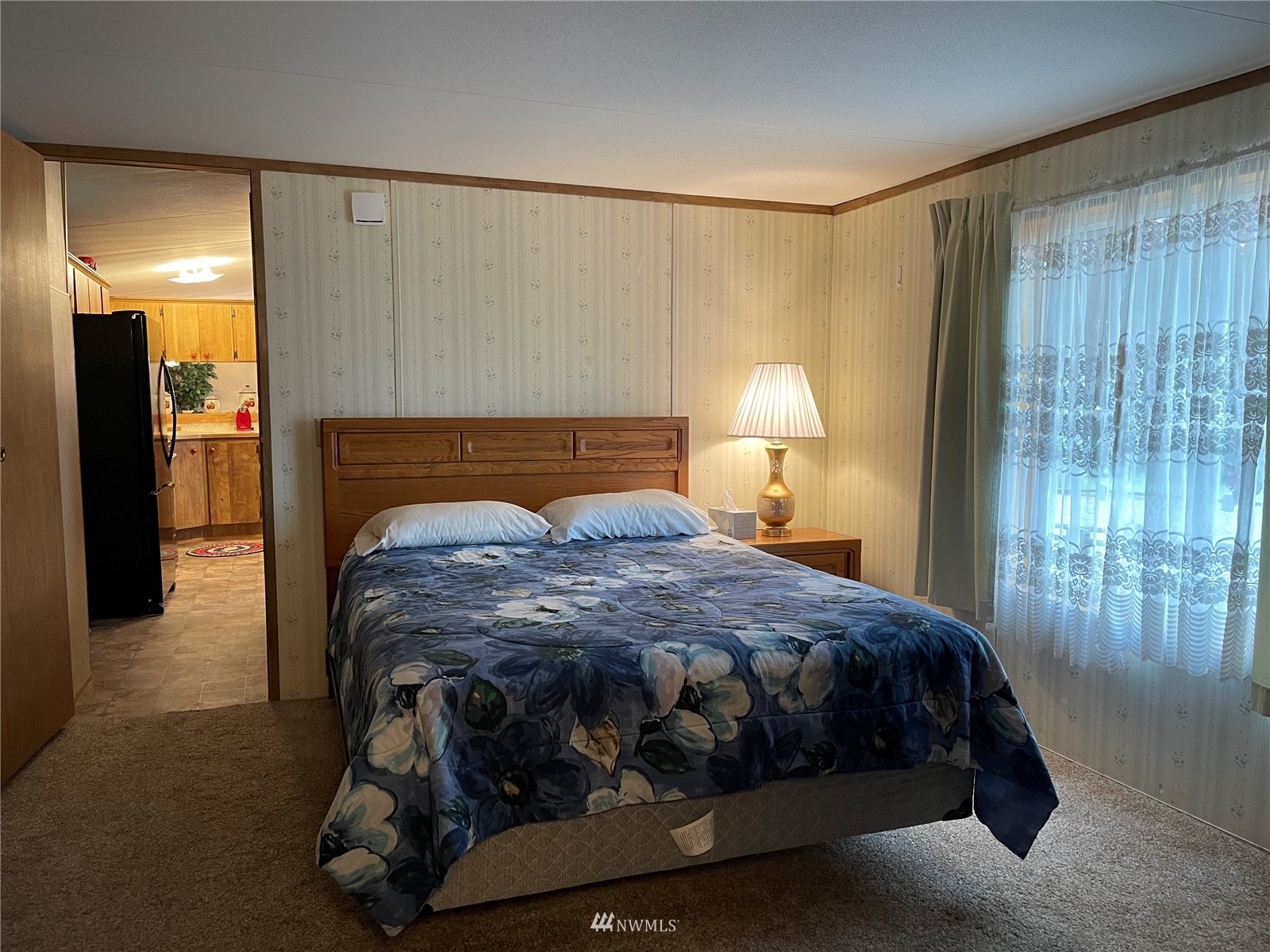 103 Klondike Road Republic, WA 99166 - Photo 16 of 38 a bedroom with a bed and a lamp