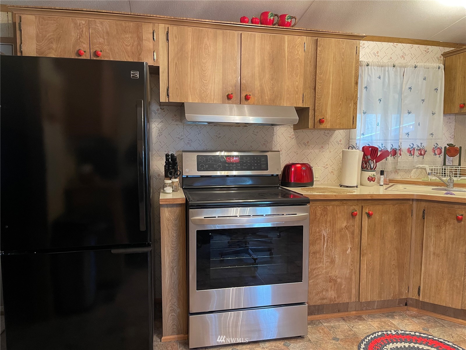 103 Klondike Road Republic, WA 99166 - Photo 2 of 38 a kitchen with stainless steel appliances granite countertop a refrigerator and a stove