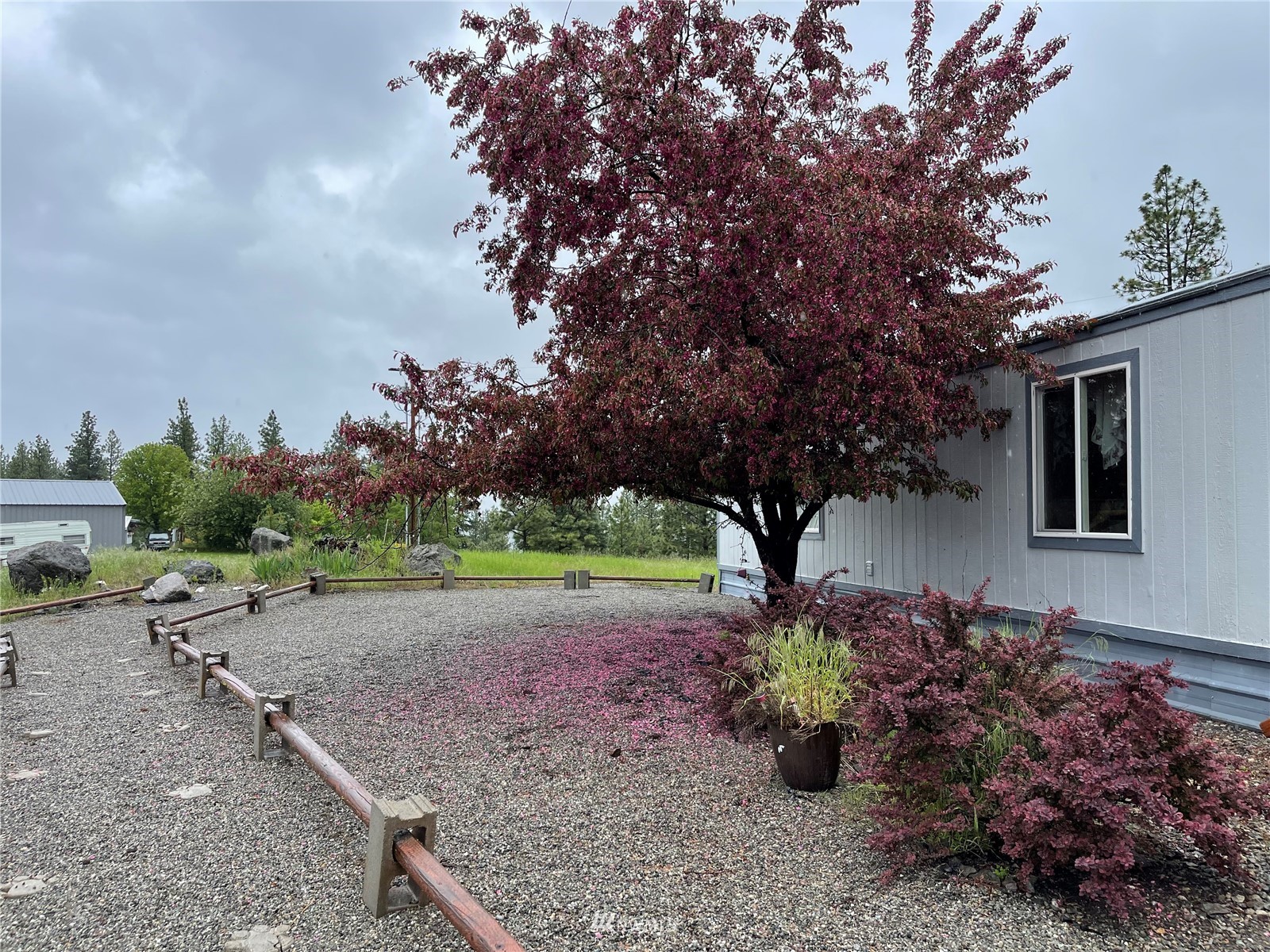 103 Klondike Road Republic, WA 99166 - Photo 23 of 38 a front view of a house with garden