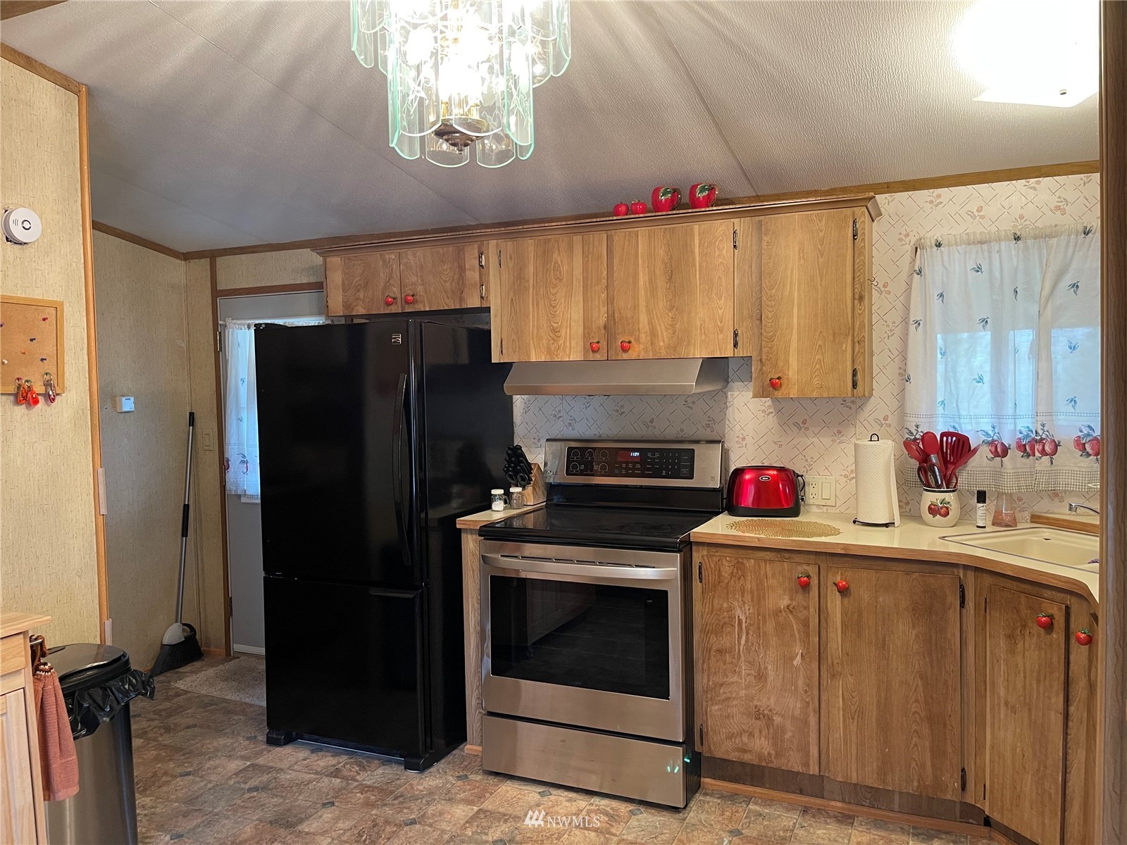 103 Klondike Road Republic, WA 99166 - Photo 4 of 38 a kitchen with stainless steel appliances a stove a refrigerator and cabinets