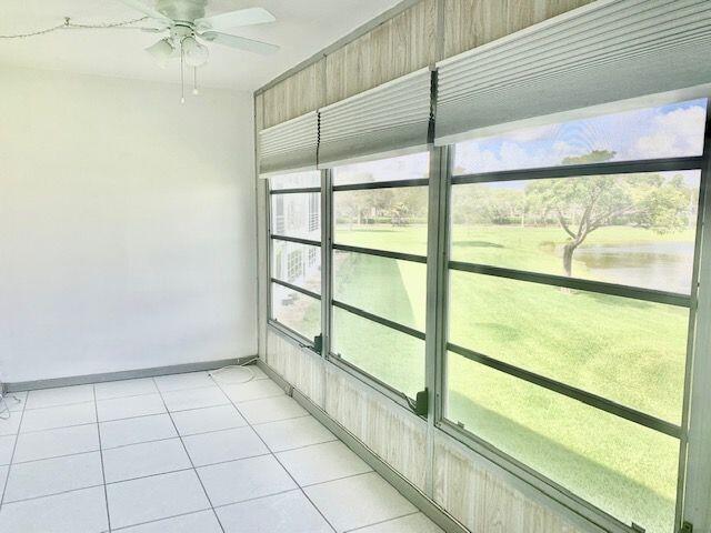 2093 Cornwall East Boca Raton, FL 33434 - Photo 13 of 35 Enclosed Patio w/ Lake View