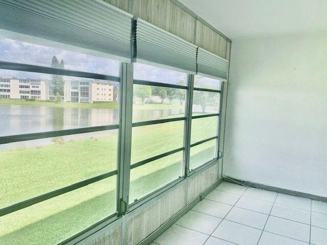2093 Cornwall East Boca Raton, FL 33434 - Photo 14 of 35 Enclosed Patio w/Lake View