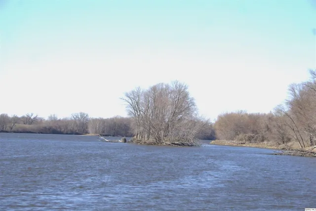 a view of a swimming pool with a yard