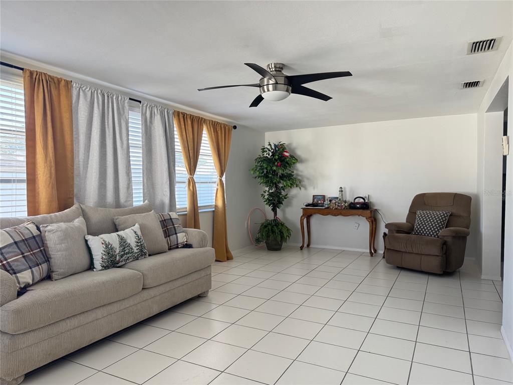 11234 Linden Lane Port Richey, FL 34668 - Photo 11 of 25 a living room with furniture and a large window