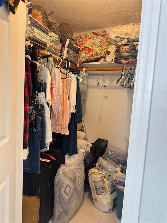 11234 Linden Lane Port Richey, FL 34668 - Photo 17 of 25 a view of walk in closet with clothes and shoes