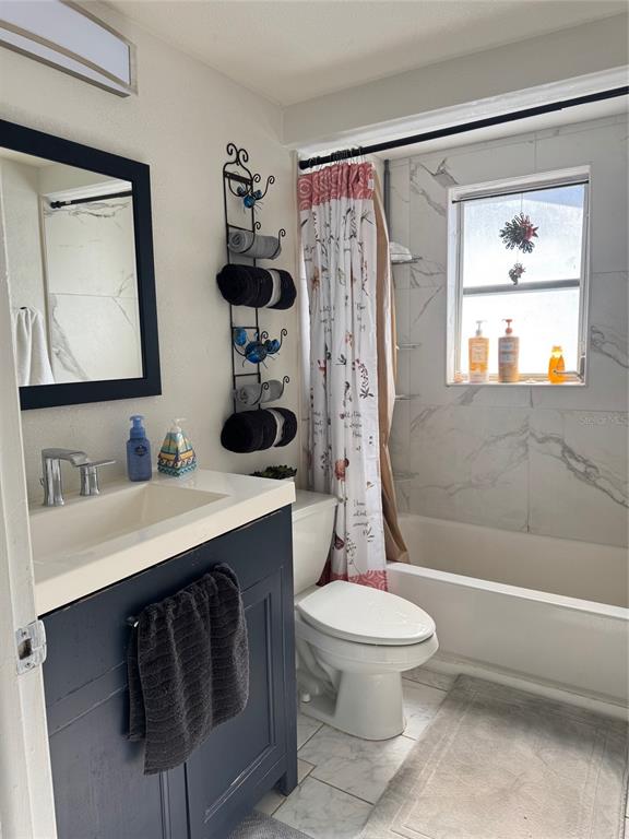 11234 Linden Lane Port Richey, FL 34668 - Photo 18 of 25 a bathroom with a sink toilet and shower