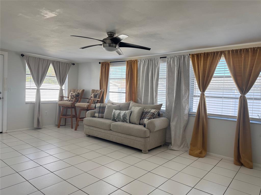 11234 Linden Lane Port Richey, FL 34668 - Photo 10 of 25 a living room with furniture and a window