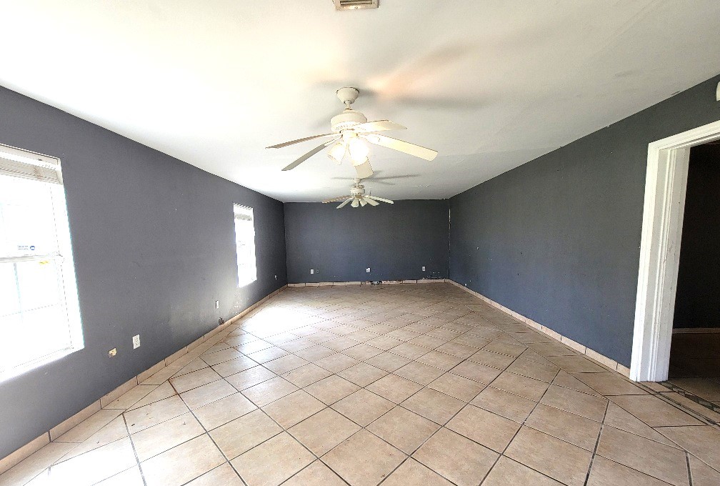705 Inwood Drive Baytown, TX 77521 - Photo 13 of 15 a view of empty room with window