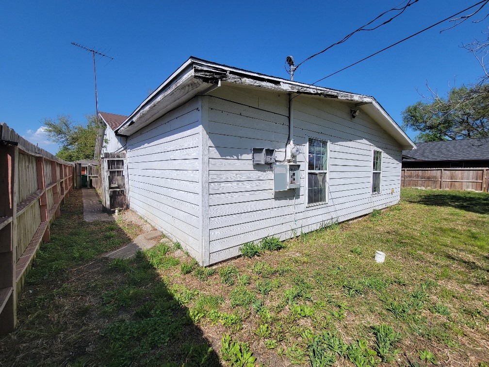 705 Inwood Drive Baytown, TX 77521 - Photo 5 of 15 a view of a house with a yard