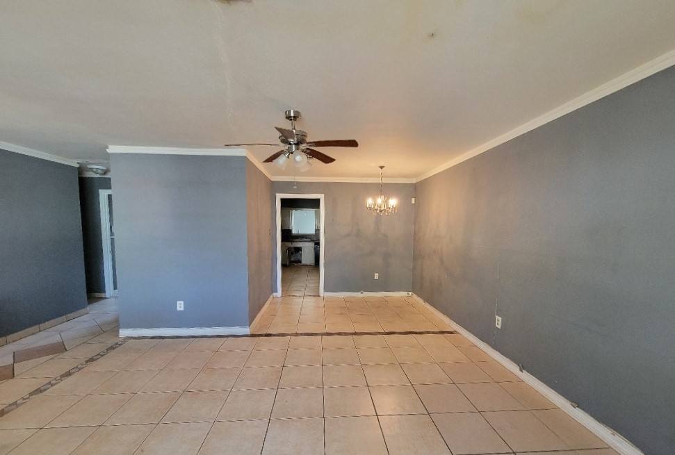 705 Inwood Drive Baytown, TX 77521 - Photo 7 of 15 a view of a livingroom with a chandelier