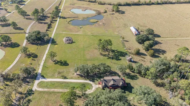 a kitchen with a sink a stove and a wooden floor