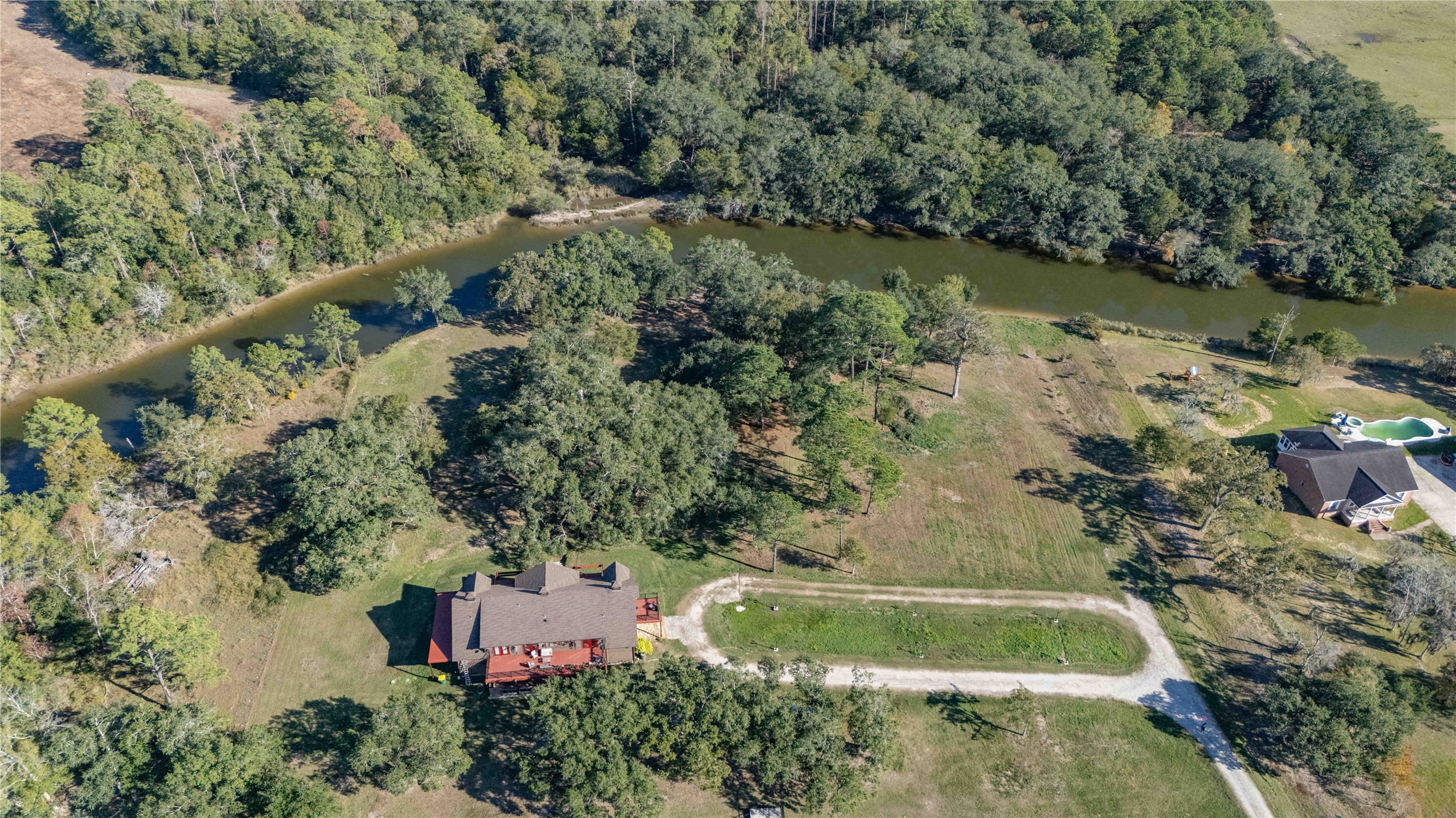 6641 Eagle Road Anahuac, TX 77514 - Photo 14 of 50 an aerial view of house with yard swimming pool and outdoor seating