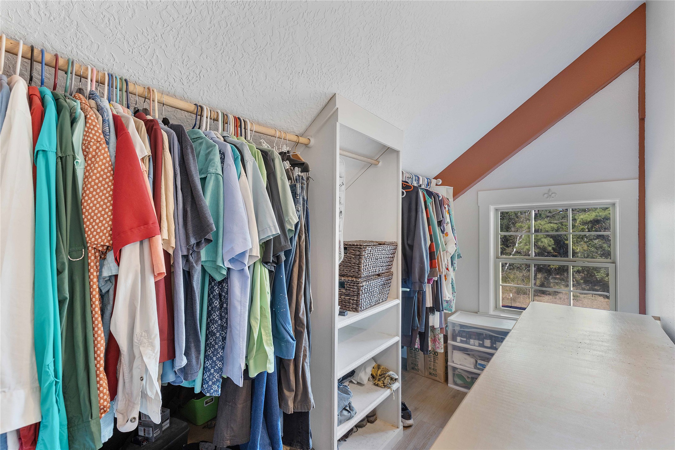 6641 Eagle Road Anahuac, TX 77514 - Photo 31 of 50 a view of walk in closet with clothes and shoes
