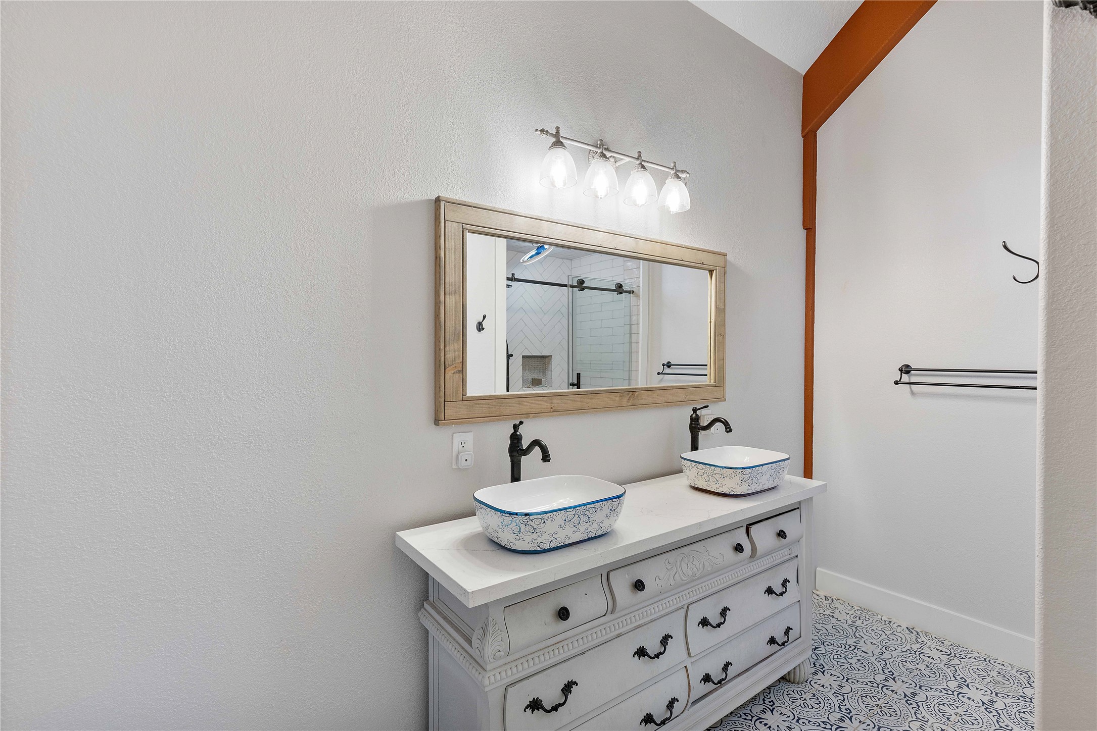 6641 Eagle Road Anahuac, TX 77514 - Photo 33 of 50 a bathroom with a sink a mirror and a vanity
