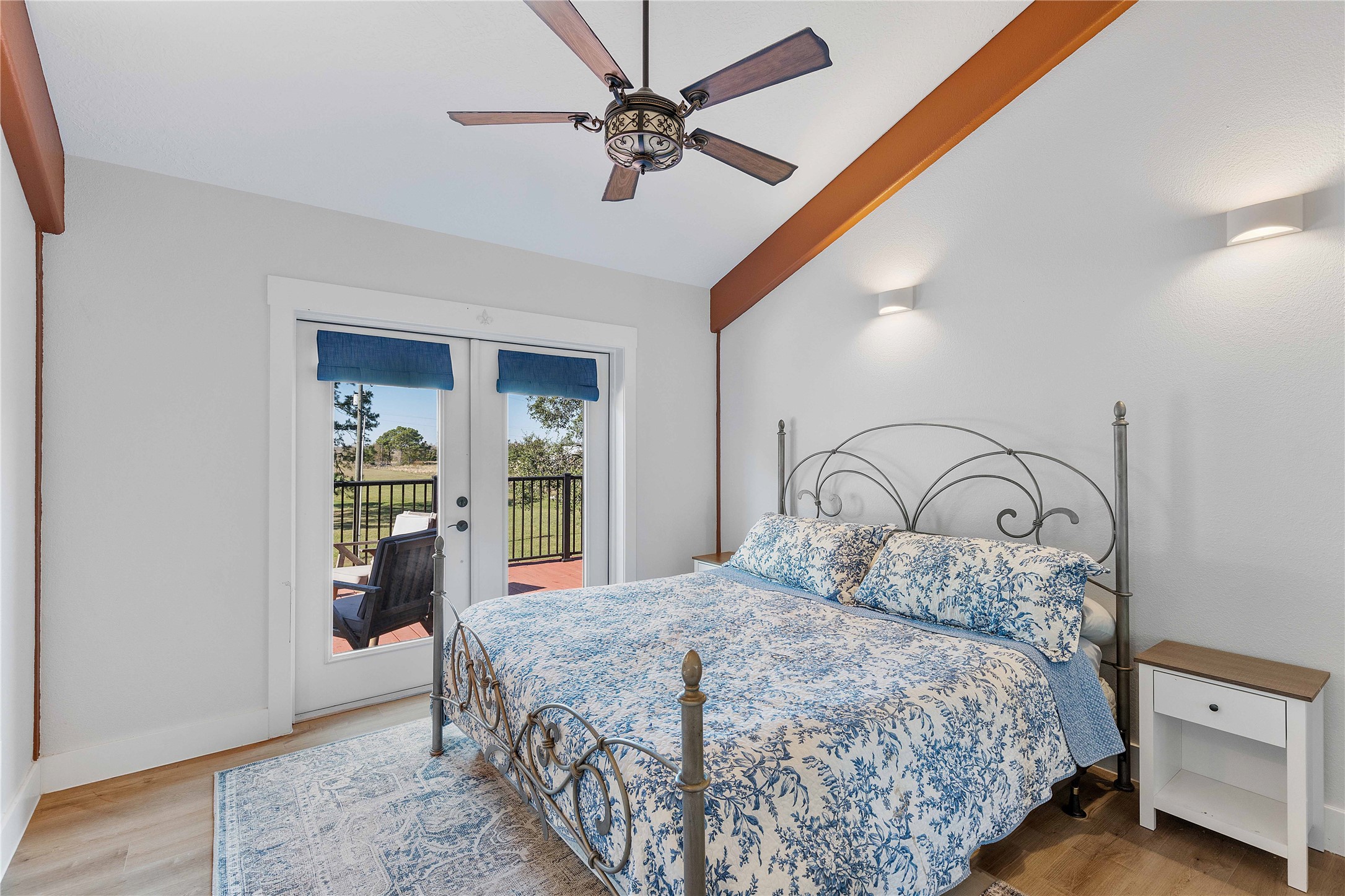 6641 Eagle Road Anahuac, TX 77514 - Photo 41 of 50 a bedroom with a large bed and a chandelier