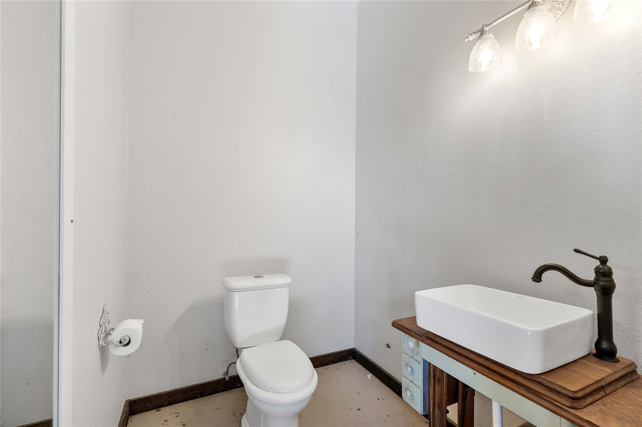 6641 Eagle Road Anahuac, TX 77514 - Photo 46 of 50 a bathroom with a toilet a sink and mirror