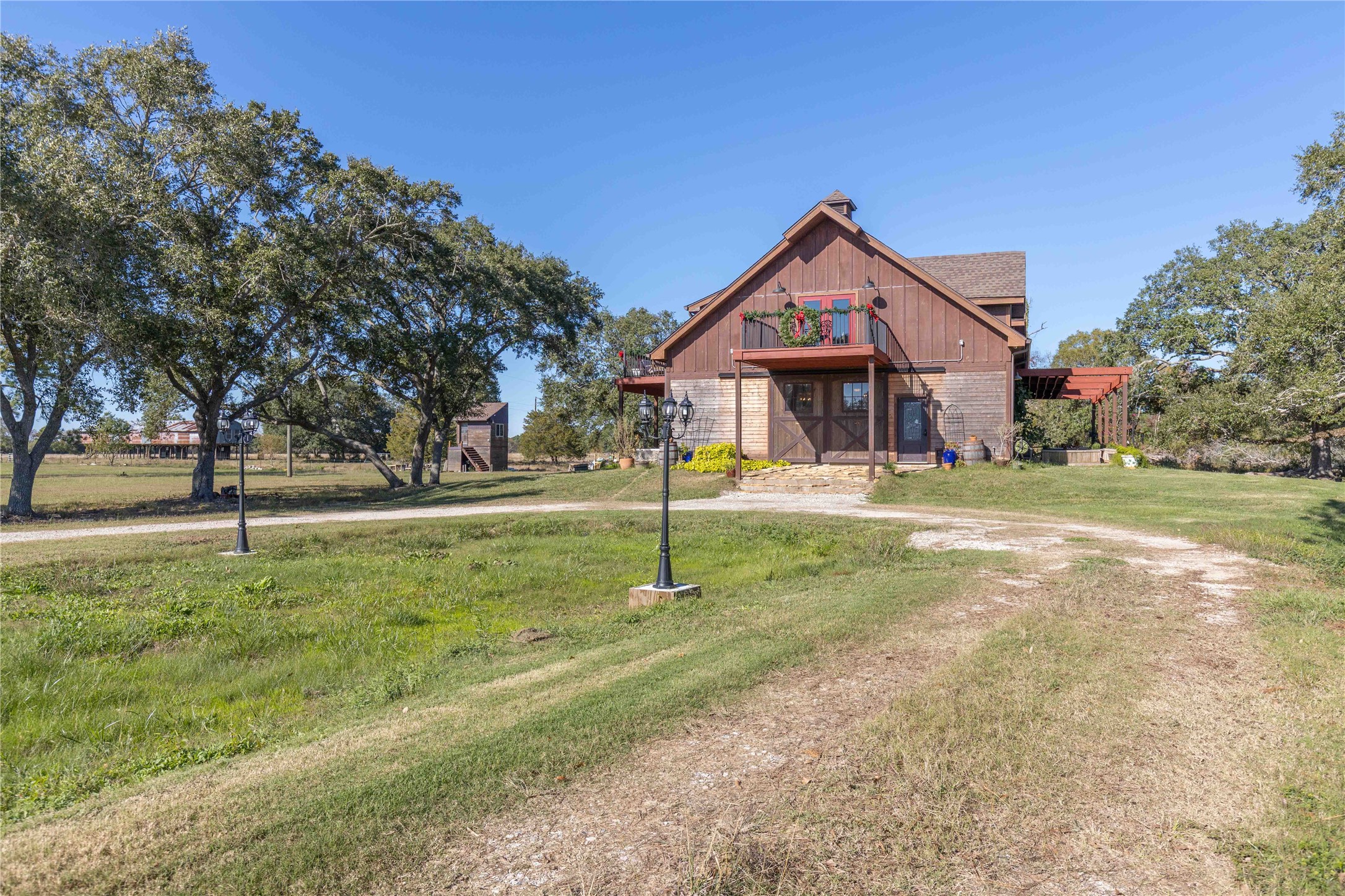 6641 Eagle Road Anahuac, TX 77514 - Photo 7 of 50 a house with green field in front of it