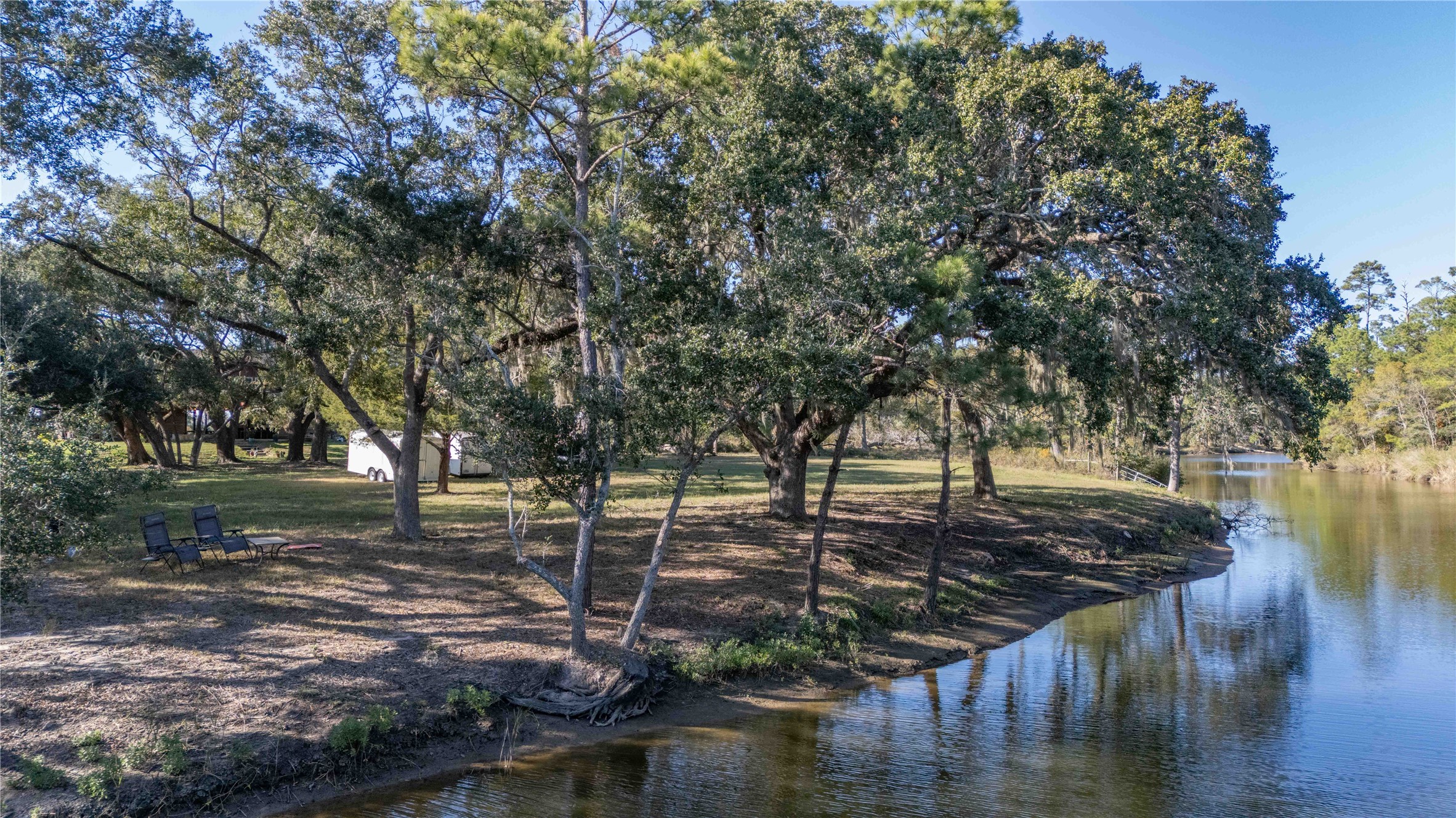 6641 Eagle Road Anahuac, TX 77514 - Photo 10 of 50 a view of a lake with lots of trees
