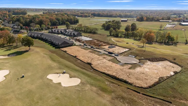 a view of a swimming pool with a yard