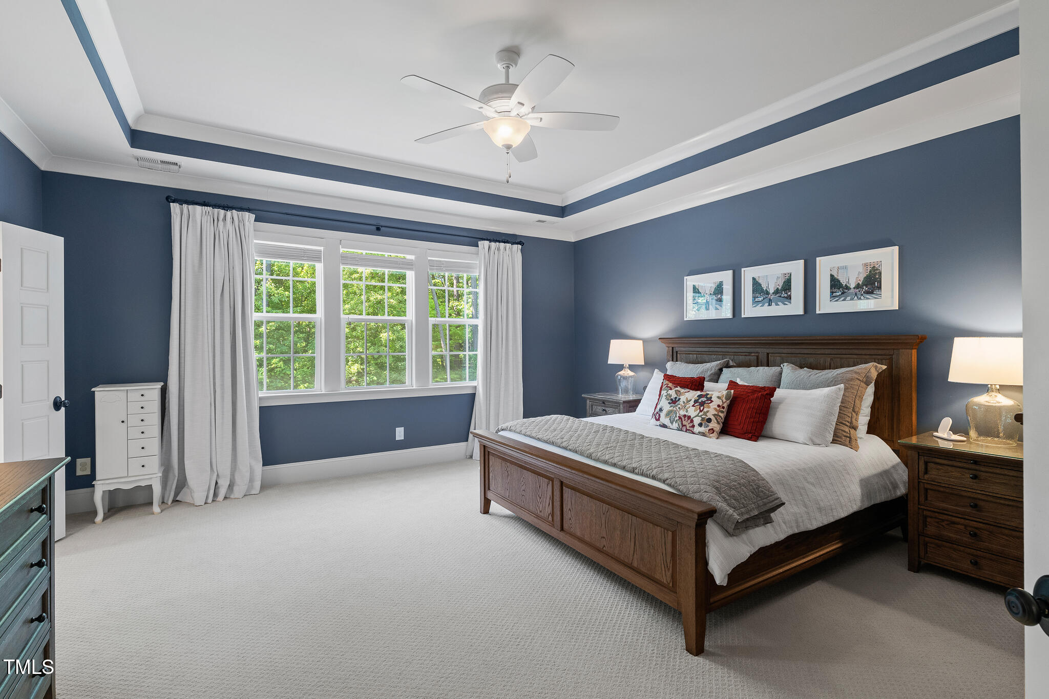 2993 Club Drive Raleigh, NC 27613 - Photo 46 of 94 a bed sitting in a bedroom next to a window