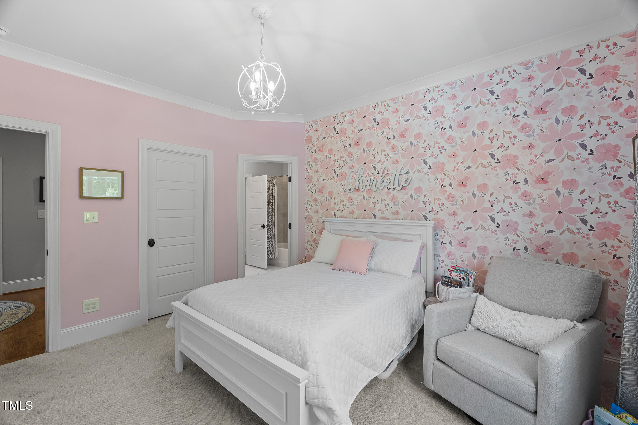 2993 Club Drive Raleigh, NC 27613 - Photo 56 of 94 a bedroom with a bed and a chandelier