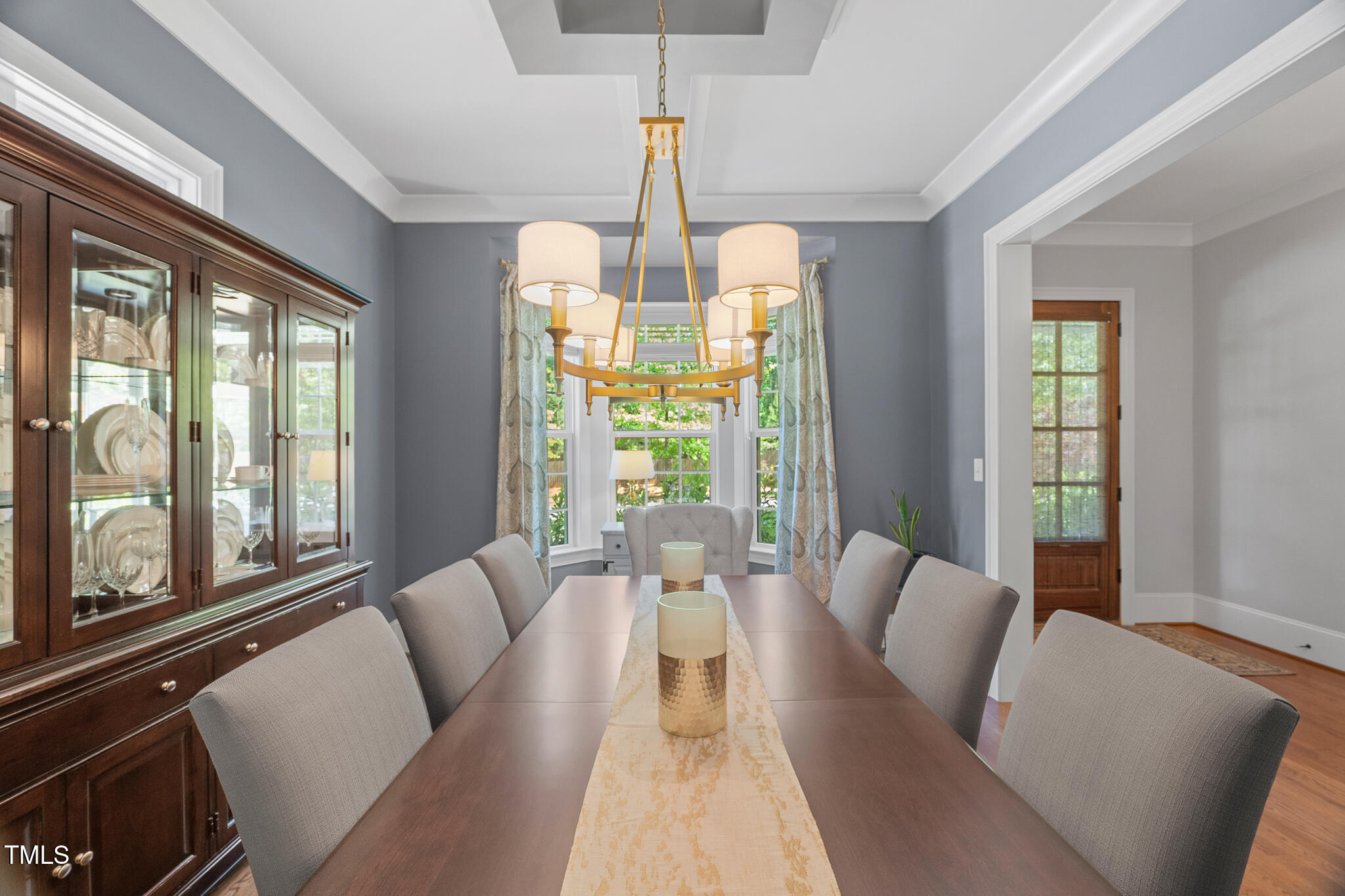 2993 Club Drive Raleigh, NC 27613 - Photo 6 of 94 a living room with furniture and a chandelier