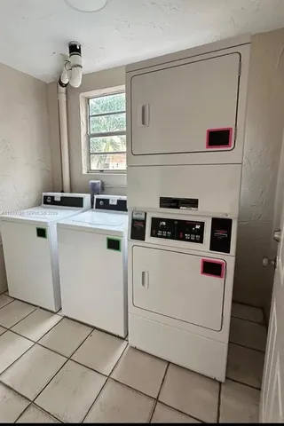 a kitchen with a stove cabinets and a refrigerator
