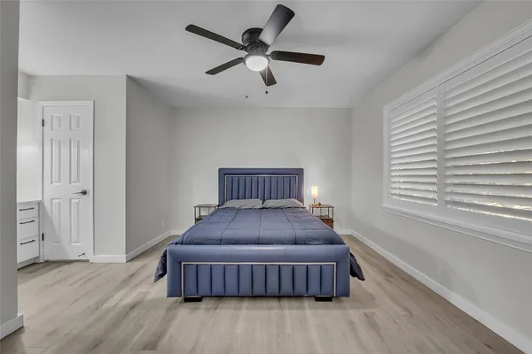 a bedroom with a bed and window