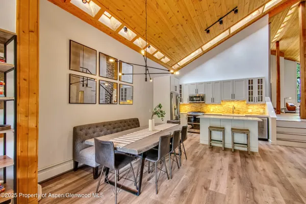 a dining room with a table and chairs