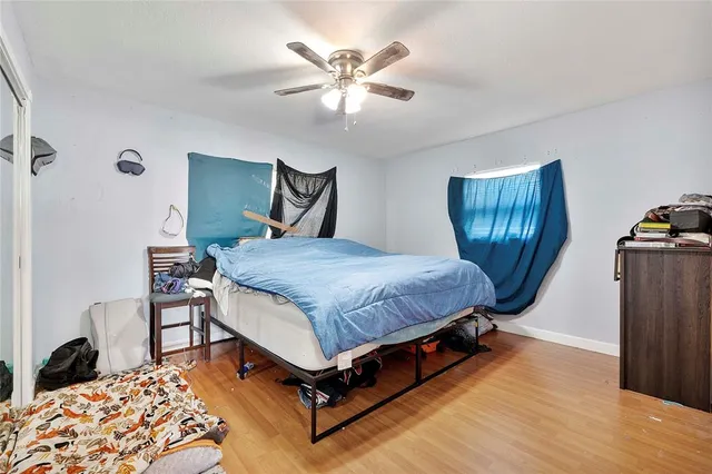 a living room with a bed furniture and a window