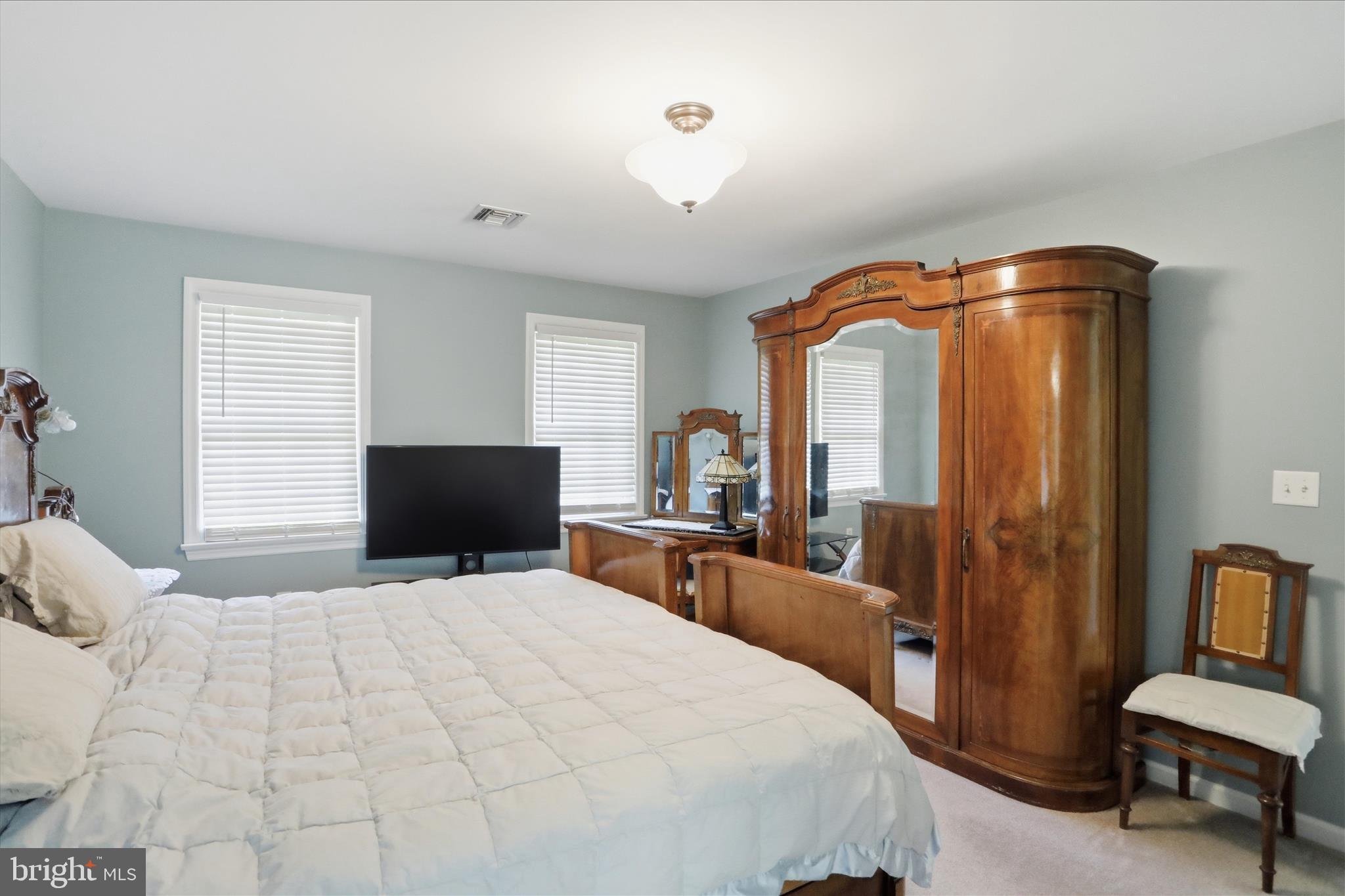 1175 North Lakewood Drive Ridgeley, WV 26753 - Photo 21 of 33 a bedroom with a bed and wooden floor