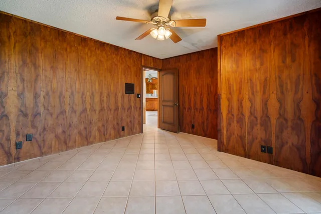 a view of a livingroom with a chandelier fan