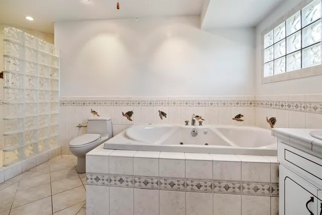 a bathroom with a bathtub and a sink