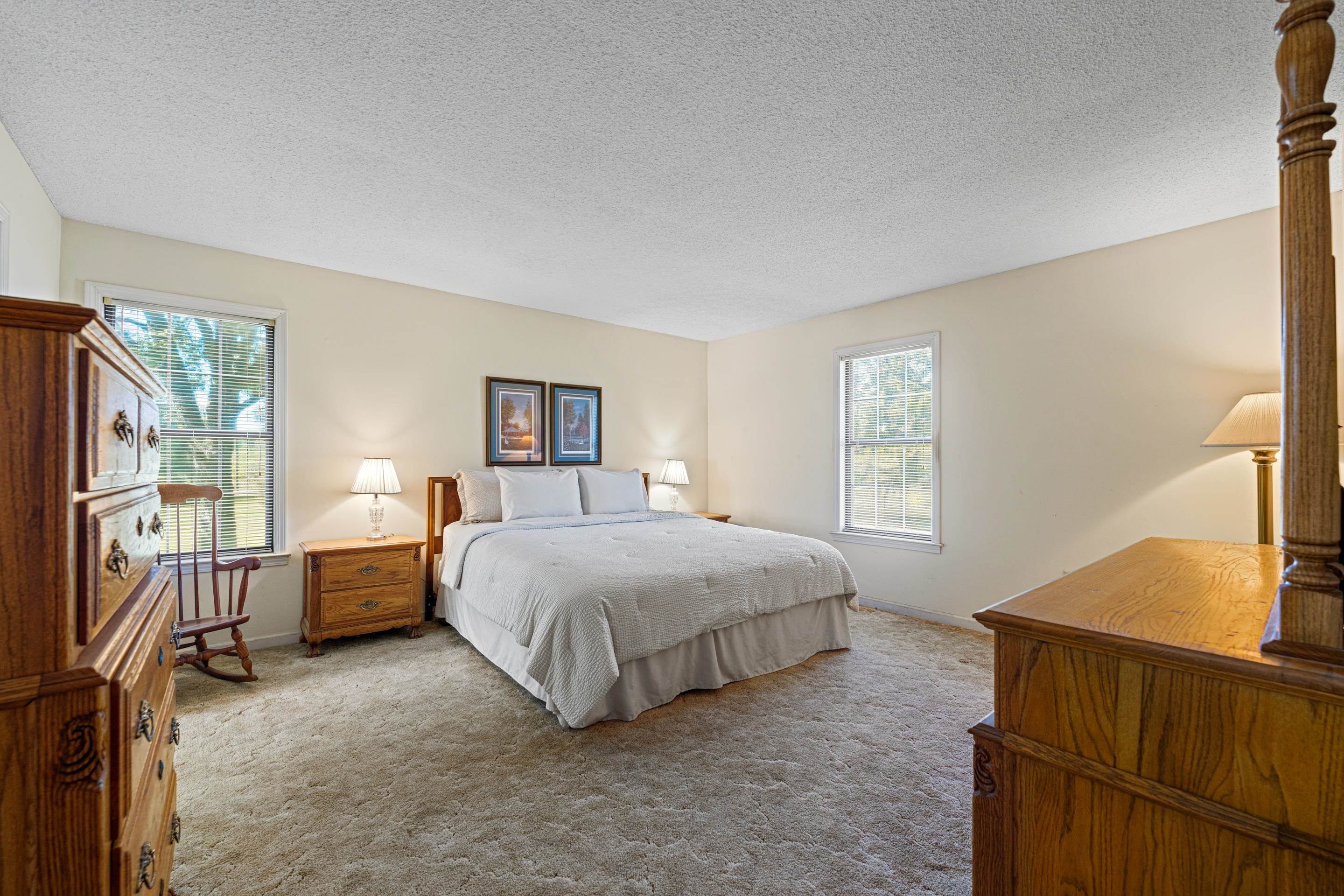 650 Blain Road Rossville, TN 38066 - Photo 13 of 26 The primary suite offers abundant space and a seamless connection to its private en suite bathroom. Ideal for unwinding after a long day, this room combines comfort, functionality, and timeless appeal in one restful retreat.